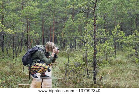 Young Man Photographing Nature In An Old Bog In Estonia