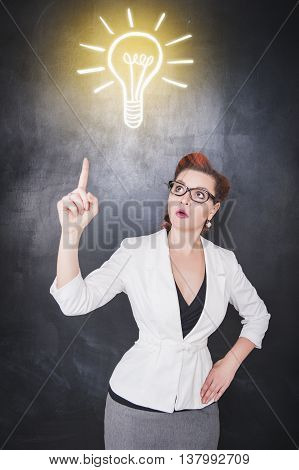 Idea Concept. Woman Showing On Drawing Lamp