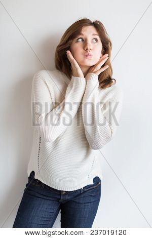 Playing, Childhood, Fashion Concept. There Is An Adorable And Funny Young Woman Who Is Squirming And
