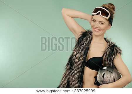 Winter Sport Activity Concept. Atractive Smiling Woman Wearing Black Bra, Ski Goggles And Furry Wais