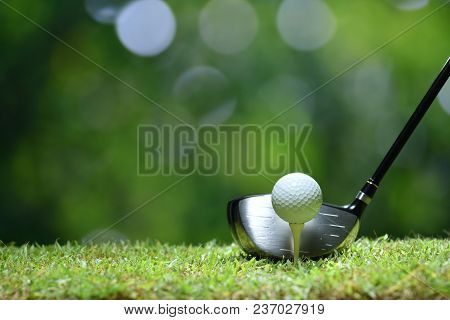 Golf Ball On Green Grass Ready To Be Struck On Golf Course Background