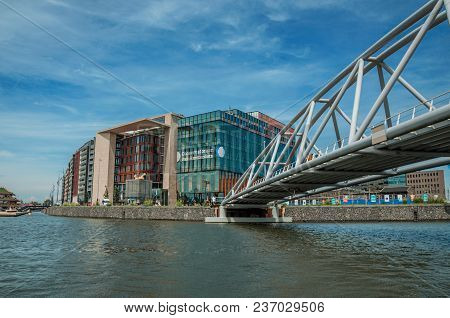 Amsterdam, Northern Netherlands - June 27, 2017. Conservatorium Van Amsterdam Building And Iron Brid