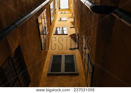 Wall With Windows Of An Orange Building In Old Part Of A European Town. Building In The Center Of St