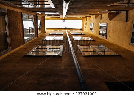 Walls With Windows Of An Orange Building In Old Part Of A European Town. Building In The Center Of S