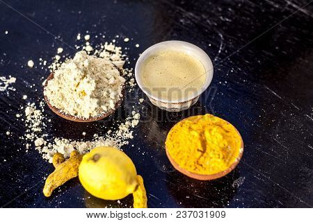 Chana,haldi,limbo Ka Ubtan Or Ayurvedic Face Pack Of Turmeric, Lemon, And Gram Flour On Wooden Surfa