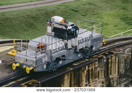 Locomotives, Known As Mules, Pull Ships In The Panama Canal