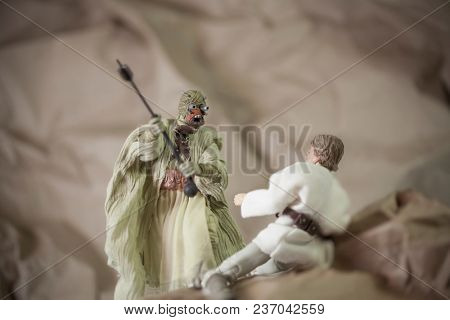 APR 17 2018: Recreation of a scene from Star Wars A New Hope; Luke Skywalker is attacked by a Tusken Raider on the desert planet of Tattooine - Hasbro Black Series 6 inch action figures