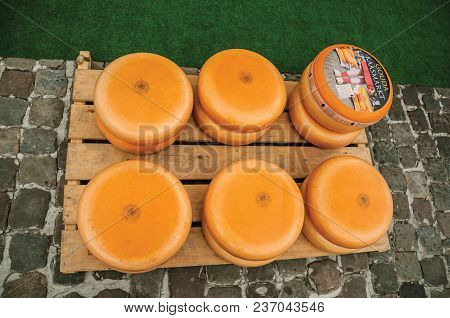 Gouda, Southern Netherlands - June 29, 2017. Close-up Of Cheeses Stacks For Sale At The Market Squar