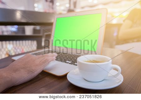 Youngman Working With Laptop In Cafe, Laptop With Green Screen.