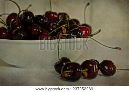 Beautiful Juicy Fresh Summer Cherries In A White Bowl On A Vintege Background