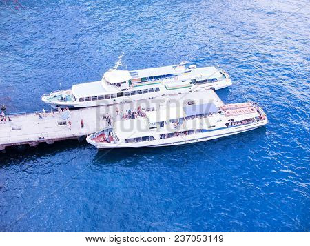 The Sea Is Blue. An Old Boat Is Transporting People.