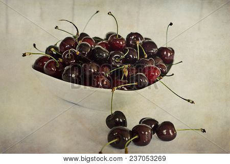 Beautiful Juicy Fresh Summer Cherries In A White Bowl On A Vintege Background