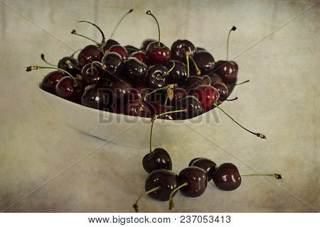 Beautiful Juicy Fresh Summer Cherries In A White Bowl On A Vintege Background