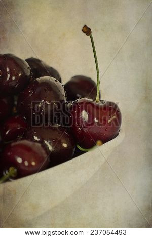 Beautiful Juicy Fresh Summer Cherries In A White Bowl On A Vintege Background