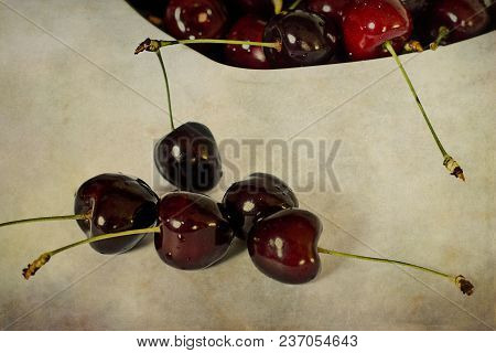 Beautiful Juicy Fresh Summer Cherries In A White Bowl On A Vintege Background