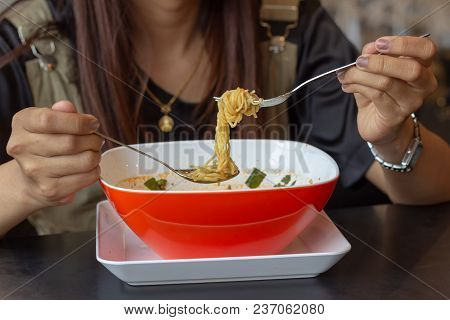 Young Girl Eating Noodles,hastily Lunch,tom Yum Noodles
