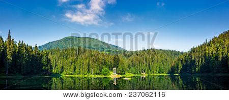 Panorama Of Synevyr Lake On Summer Morning. Gorgeous Scenery With Spruce Forest Reflecting On A Wate
