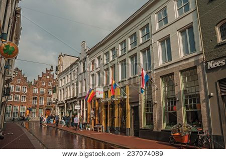 S-hertogenbosch, Southern Netherlands - July 01, 2017. Street With Pubs, Rainbow Flag And People Str