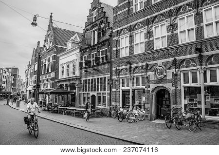 S-hertogenbosch, Southern Netherlands - July 01, 2017. Street With Restaurants, Shops, Cyclist And P