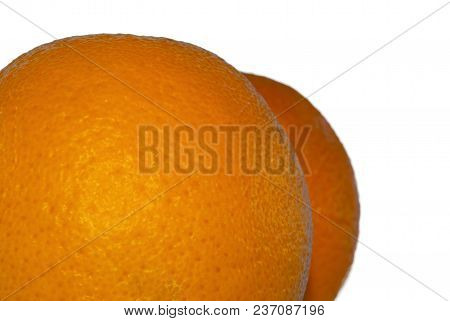 Bright Colored Sides Of Two Oranges Slightly Resembling Human Buttocks With Cellulite, On A White Ba
