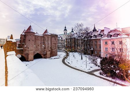 Warsaw Barbacan Fortress Castle In Winter Is In The Capital City Of Poland. Old Town Is The Historic