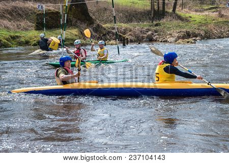 Grodno, Belarus - April, 2018: Kayak Freestyle Competition On Fast Cold Water River Strenuously Rowi