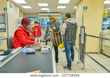 ROME, ITALY - CIRCA NOVEMBER 2017: cashier in Conad supermarket in Rome.