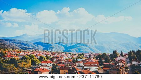 Sunset In Balkan Mountains, Dobrinishte City. Europe, Bulgaria, Dodrinishte Town Panoramic View.