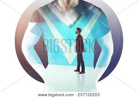 Businessman Standing In Abstract Interior. Employment And Think Concept. Double Exposure