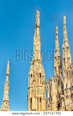 Detail With Marble Spiers And Statues On The Roof Of The Gothic Cathedral Of Milan, Italy