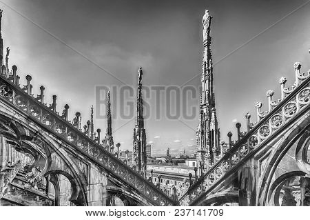 Detail With Marble Spiers And Statues On The Roof Of The Gothic Cathedral Of Milan, Italy