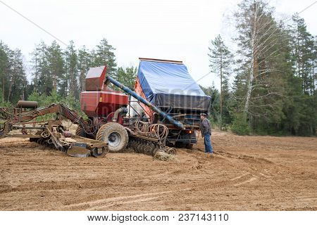 Sowing Unit, Combine Harvester, Seeder And Lorry, Dumper On The Field.