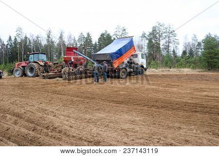 Sowing Unit, Combine Harvester, Seeder And Lorry, Dumper On The Field.