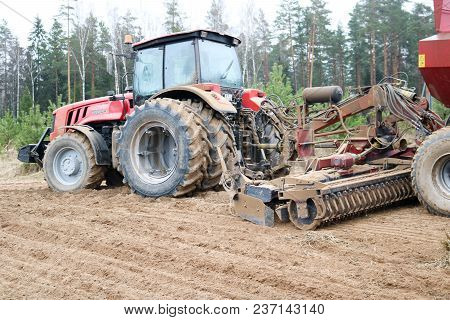 Sowing Unit, Combine Harvester, Seeder And Lorry, Dumper On The Field.