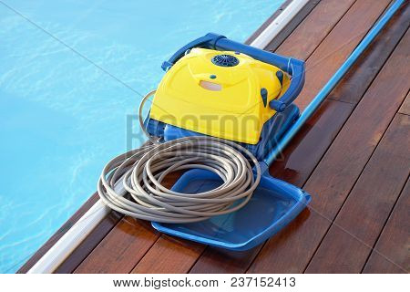 Pool Cleaner During His Work. Cleaning Robot For Cleaning The Botton Of Swimming Pools.