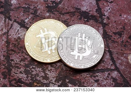 Silver And Golden Bitcoins On Red Background, Close Up. High Resolution Photo.