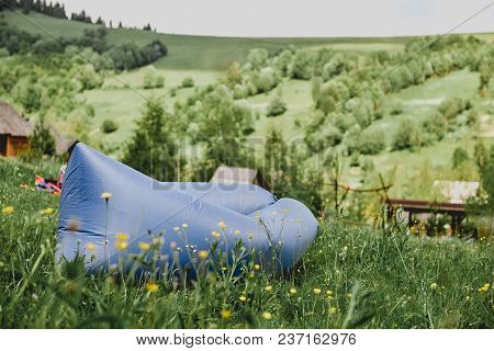 Inflatable Chaise Longue Lamzac In The Mountains In Summer. Rest On The Nature, A Day Off.