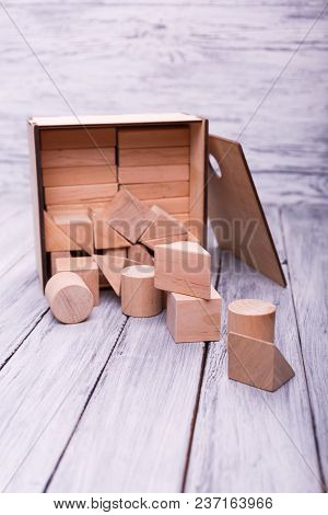 Educational Games For Children. Different Geometrical Figures On The Wooden Background. Entertaining
