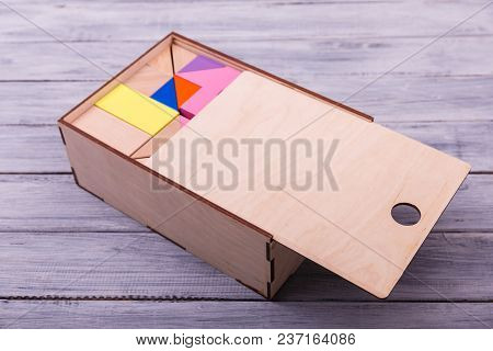 Educational Games For Children. Red, Yellow, Pink, Blue Geometrical Figures On The Wooden Background