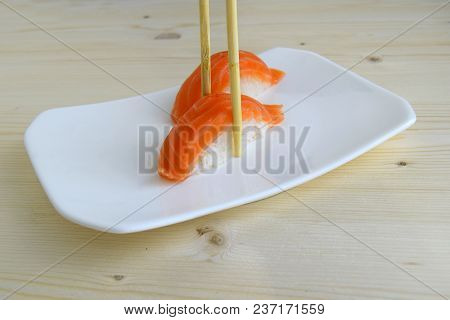 Sushi, Nigiri, Sake A Dish Of The Traditional Japanese Cuisine Cooked From Rice And A Salmon. Sushi 