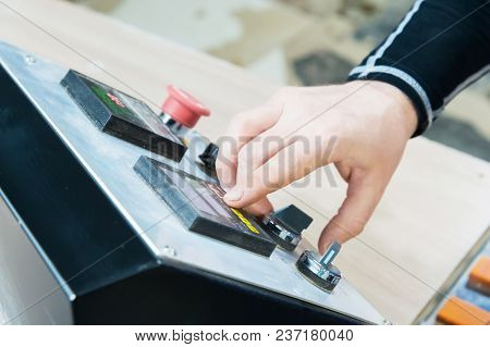A Close-up Of The Operator The Man Presses The Button On The Control Panel With The Control Devices 
