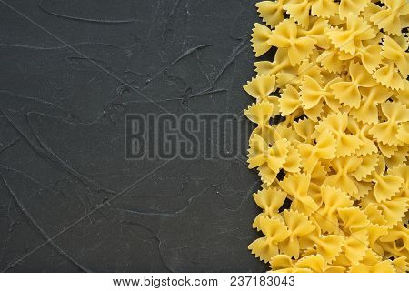 Farfalle Raw Farfallini Beautiful Decomposed Pasta With The Right, On Its Side On A Black Textured B