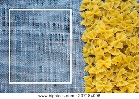 Farfalle Raw Farfallini Beautiful Decomposed Pasta With The Right, On Its Side On A Rustic Blue Knit