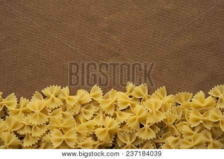 Farfalle Raw Farfallini Beautiful Decomposed Pasta From The Bottom On A Rustic Brown Textured Backgr