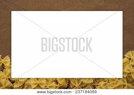 Farfalle Raw Farfallini Decomposed Pasta From The Bottom On A Rustic Brown . Close-up View From The 