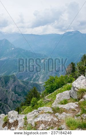 A Small Village Is At The Bottom Of A Deep Canyon