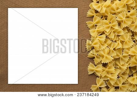 Farfalle Raw Farfallini Beautiful Decomposed Pasta With The Right, On Its Side On A Rustic Brown Tex