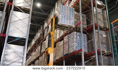 Lift Truck In Factory. Clip. Wholesale Logistic, Loading, Shipment And People Concept - Man With Loa