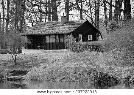 Brezany Nad Ohri, Czech Republic - April 07, 2018: Spring Nature By Ohre River With Wooden Cottage O