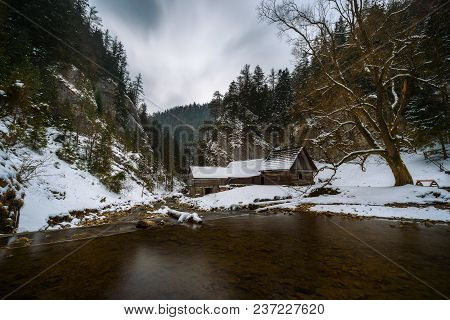 Old Wooden Water Mill At National Nature Reserve Kvacianska Dolina In Slovakia In Winter.  It Has Be